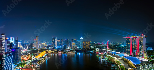 Wide panorama image of Marina Bay area in Singapore at night.