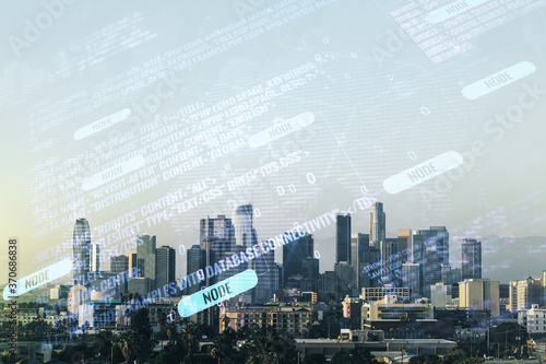 Abstract virtual coding concept and world map hologram on Los Angeles skyline background. Multiexposure