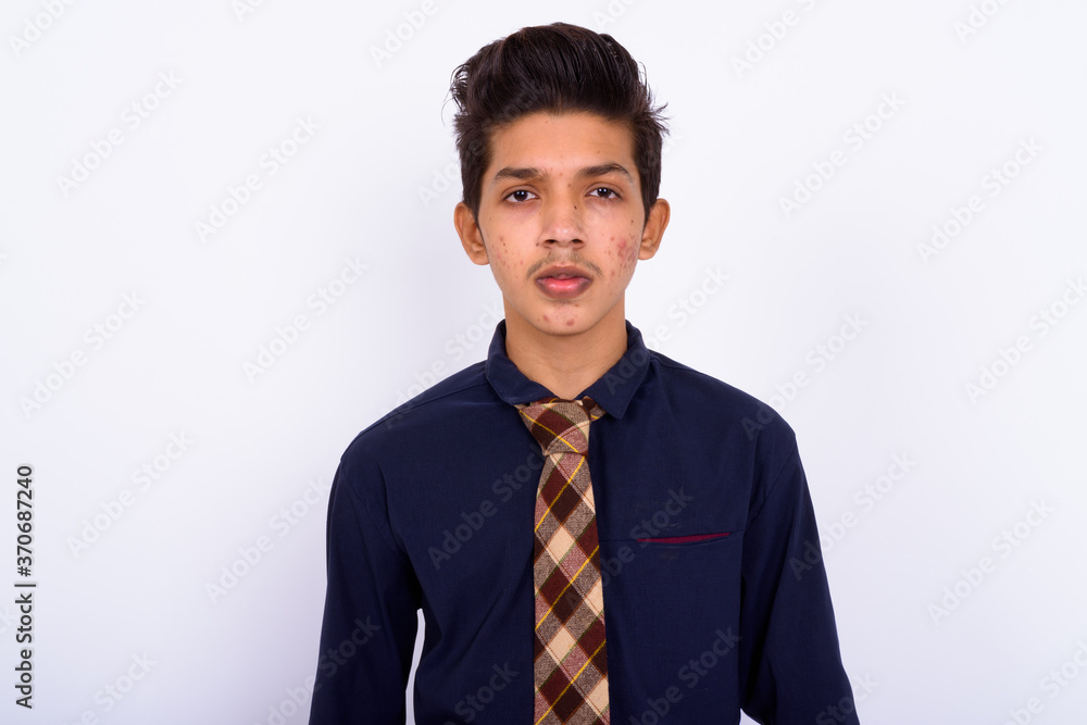 Portrait of young handsome Indian teenage boy as businessman Portrait of young handsome Indian teenage boy as businessman