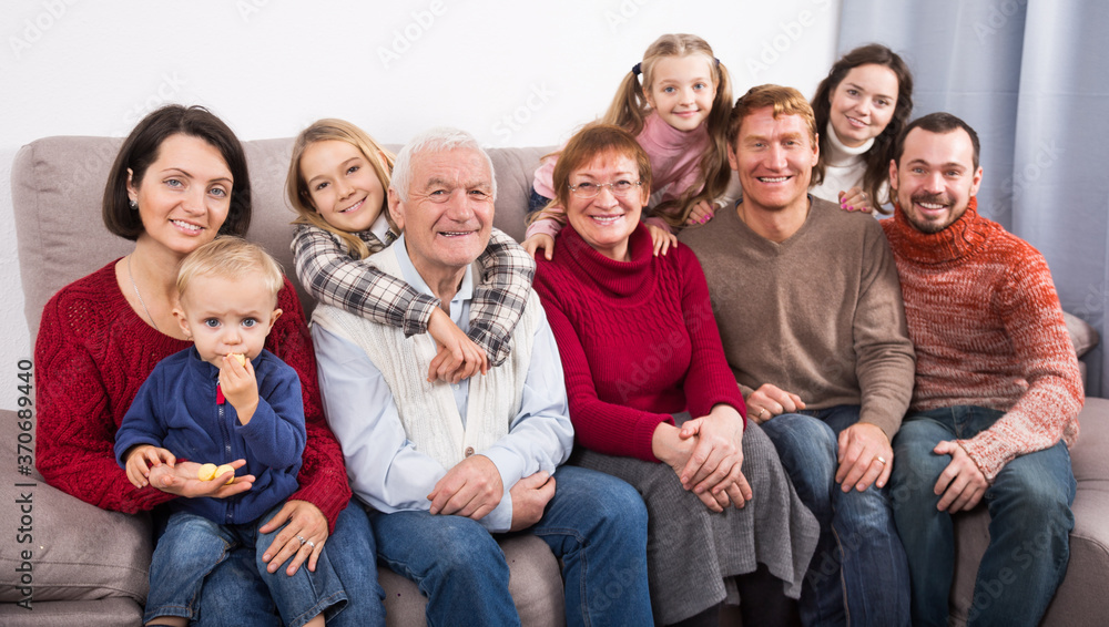 Fototapeta premium Family members making family photo during reunion party on sofa