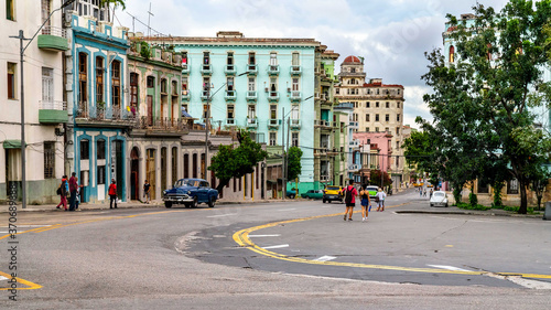 Havana, Cuba. Cars on the vibrant city`s streets. photo