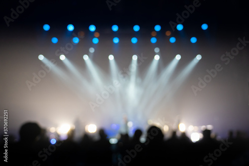 Texture blur and defocus entertainment concert lighting on stage,Integrated focus lights on the lead singer in the middle of the stage.