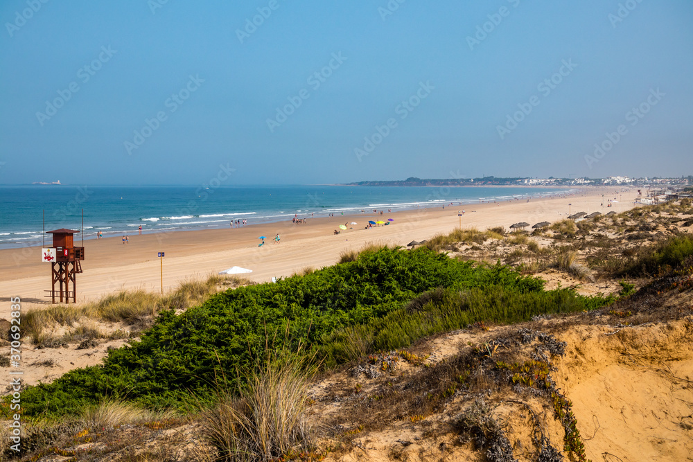 Sand dunes that give access to La Barrosa beach in Sancti Petri, Cádiz, Spain.