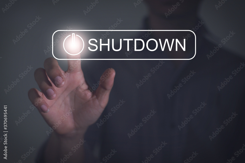 human hand press shutdown button on virtual screen with technology concept. Free space for text or design. human hand press shutdown button on virtual screen with technology concept. Free space for text or design.