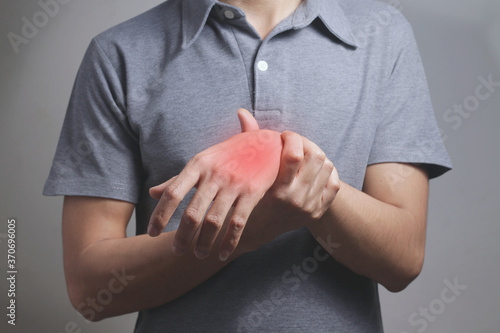 Man suffering from pain in wrist of tendon problems and Joint inflammation. Health care concept.