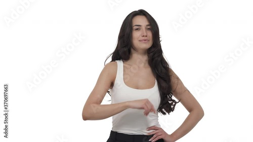 Young Caucasian woman making beckoning gesture with index finger. Come here sign. Isolated on white background