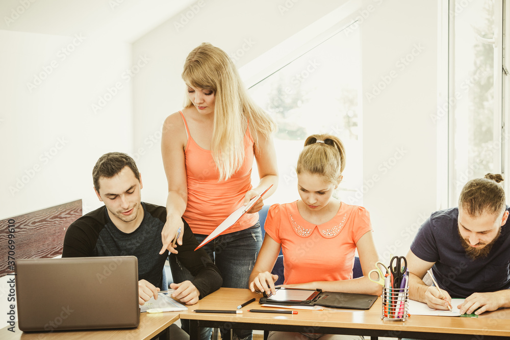 Fototapeta premium Students and teacher tutor in classroom