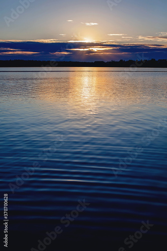 Sunset on a pond vertical photo