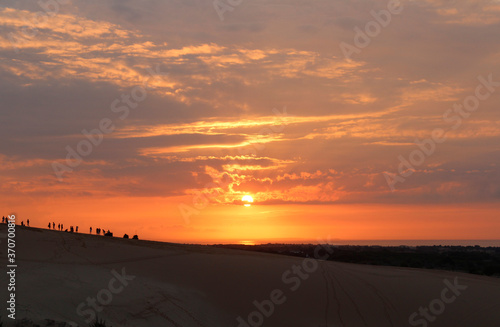 Beautiful sunrise with dramatic cloudscape at White Sand Dunes in Mui Ne, Vietnam © Crystaltmc