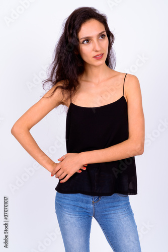 Portrait of young beautiful woman against white background