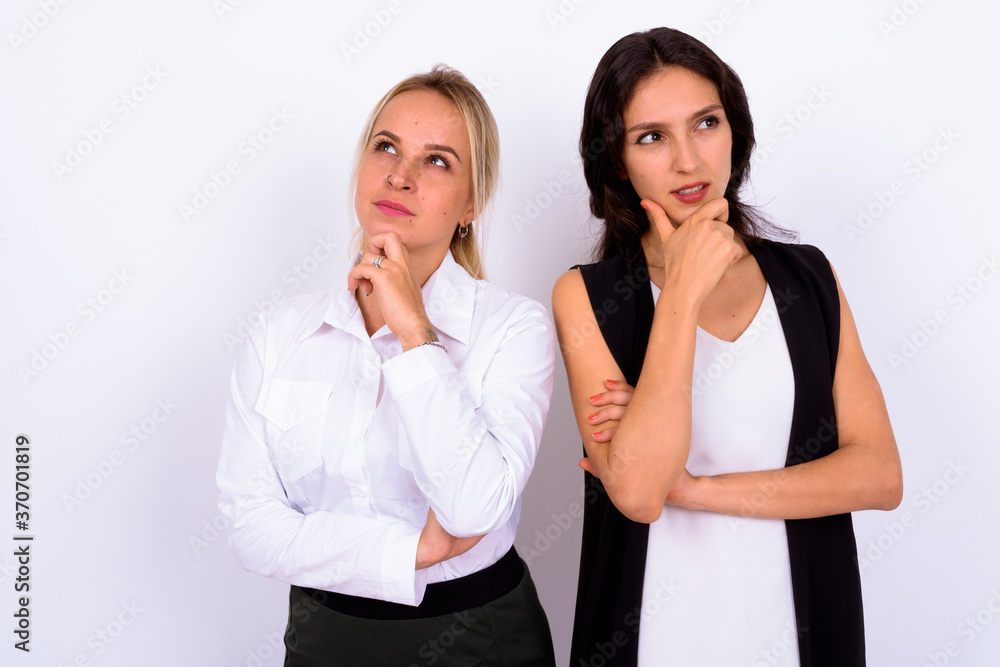 Portrait of two young beautiful businesswomen together Portrait of two young beautiful businesswomen together