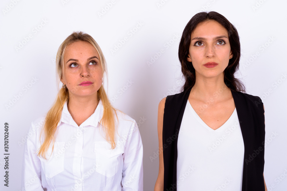 Portrait of two young beautiful businesswomen together Portrait of two young beautiful businesswomen together