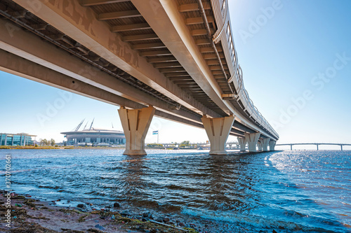 Metal structures under the bridge, large metal bridge over the water, details of the Western high-speed diameter in Saint Petersburg