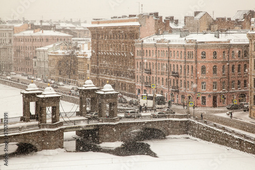 Lomonosov's bridge in time of strong snowfall. Saint petersburg cotyscape photo