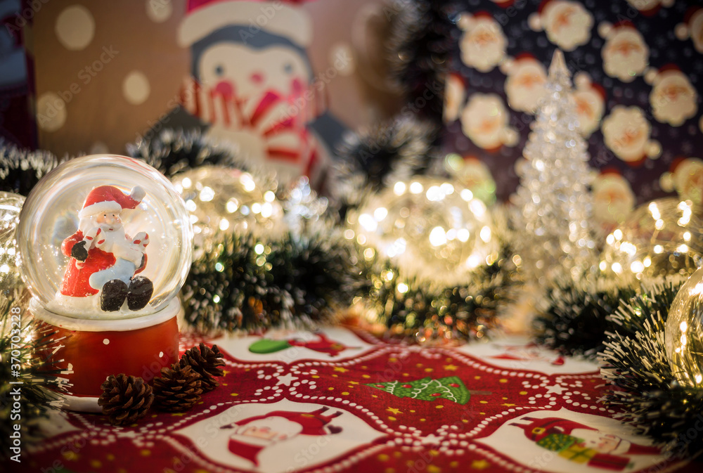 Christmas Snow Globe with lights and gifts in the background Christmas Snow Globe with lights and gifts in the background