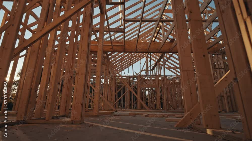 Moving through a new home construction with framing. Moving through a new home construction with framing.
