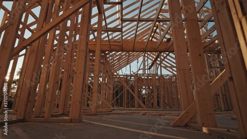 Moving through a new home construction with framing.