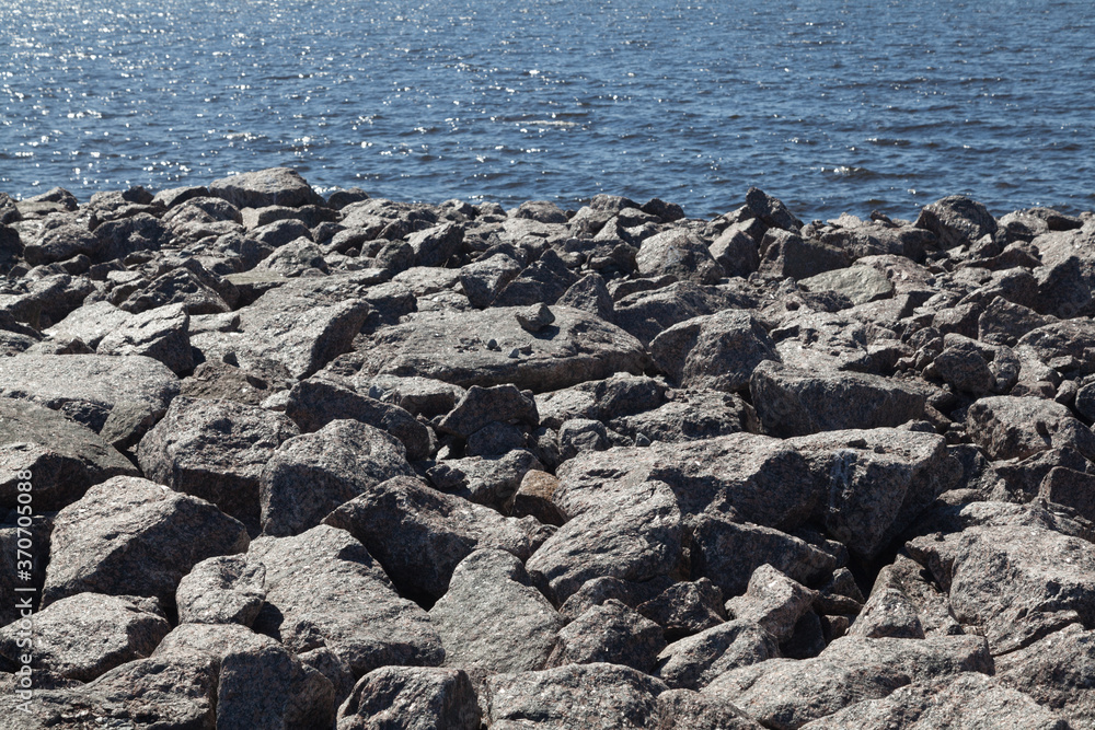 Granite rocks on a seaside texture background