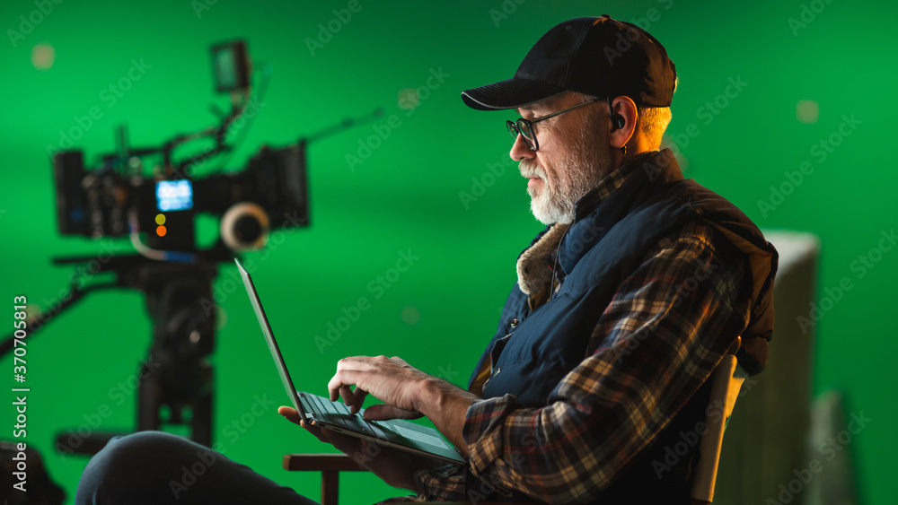 Αυτοκόλλητο Prominent Successful Director Sitting in a Chair on a Break and Using Laptop Computer