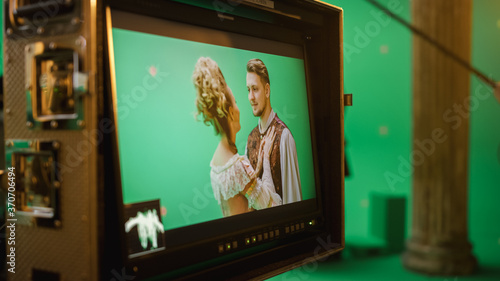 On Set Display Showing: Green Screen Scene with Two Actors Talented Wearing Renaissance Costumes Doing Romantic Drama Dialogue. Film Studio Professional Crew Shooting Historical Costume Drama Movie
