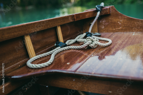 Close up rope on wooden boat. © Pintau Studio