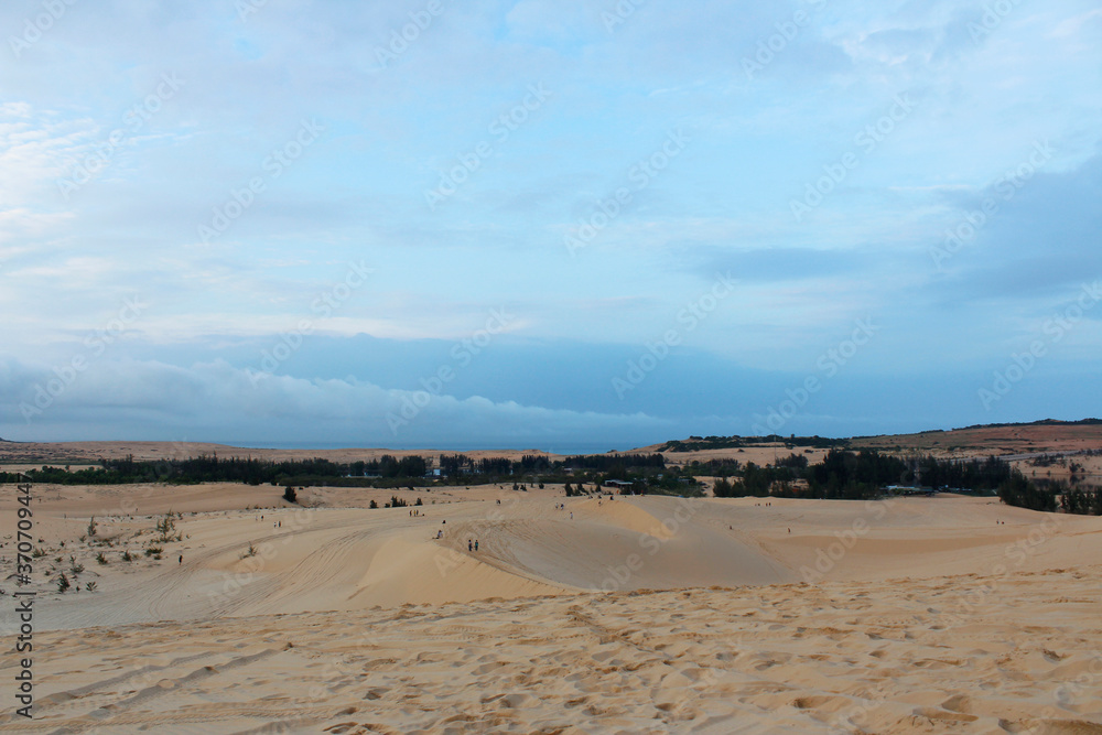 View of White Sand Dunes with the blue sky in dawn, Mui Ne, Vietnam