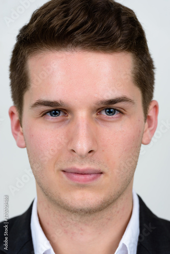 Portrait of young handsome businessman in suit