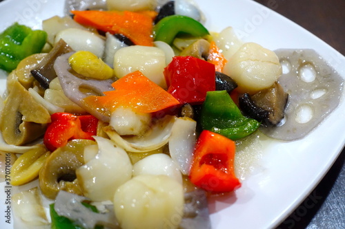 Asian Street Food - A wok-fried dish of assorted vegetables with scallops