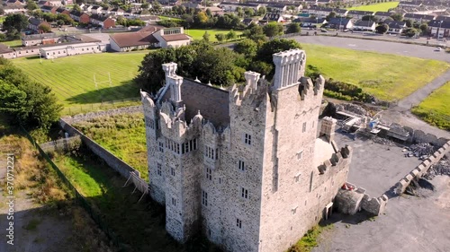 Bremore Norman Castle aerial orbit drone shot reveal of Irish coast. Beautiful sunny warm day in Balbriggan, Ireland photo