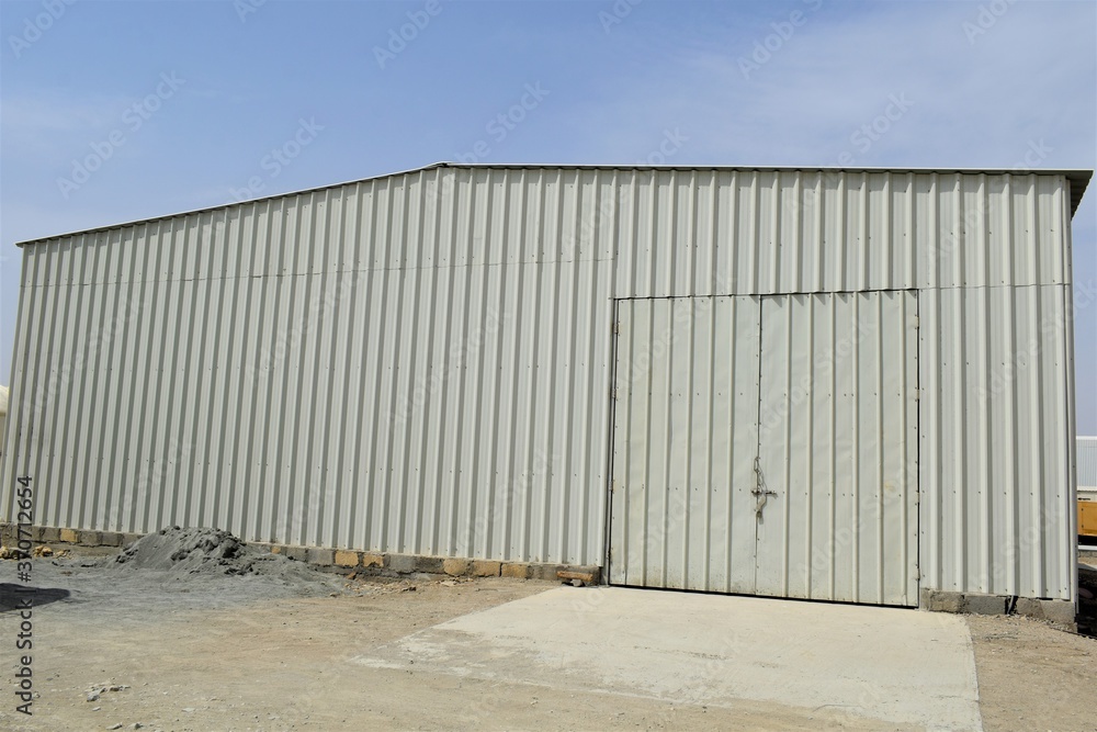outdoor view of Industrial warehouse in the site. Industrial warehouse interior and outdoor of roof ceiling structure. outdoor view of Industrial warehouse in the site. Industrial warehouse interior and outdoor of roof ceiling structure.