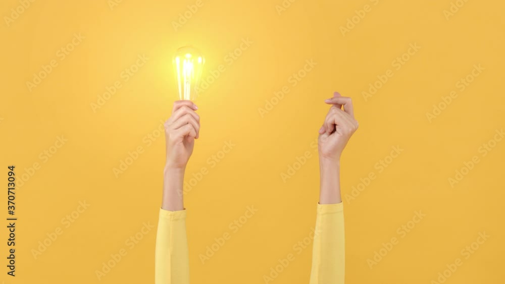Woman hand doing finger snapping to turn on light bulb for creative and idea generation concepts