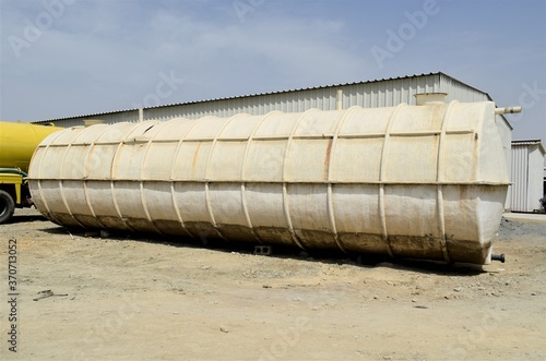 big white water tank in the construction site