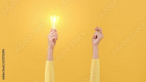 Woman hand doing finger snapping to turn on light bulb for creative and idea generation concepts photo