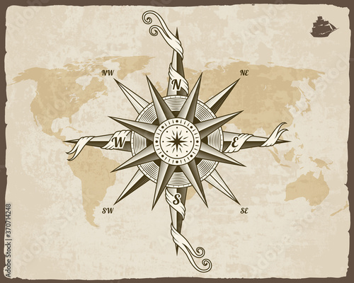 Vintage nautical compass. Old world map on vector paper texture with grunge border frame. Wind rose