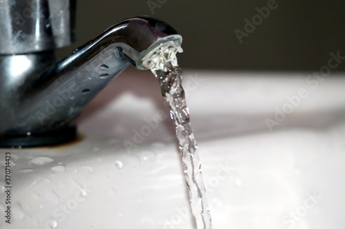 Tap water flow in washbasin