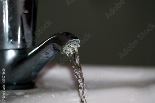 Tap water flow in washbasin