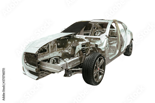 car is half disassembled. Showing the inside of the car. hood of the car without the engine and gearbox. The metal body of a car isolated on a white background