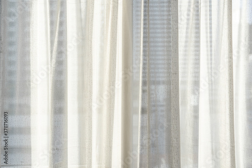 Close-up white curtain with bright sunlight