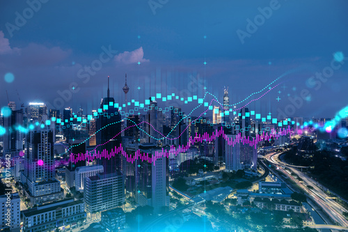 Photography FOREX graph hologram, aerial night panoramic cityscape of Kuala Lumpur