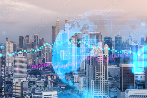 Photography Glowing FOREX graph hologram, aerial panoramic cityscape of Kuala Lumpur at sunset
