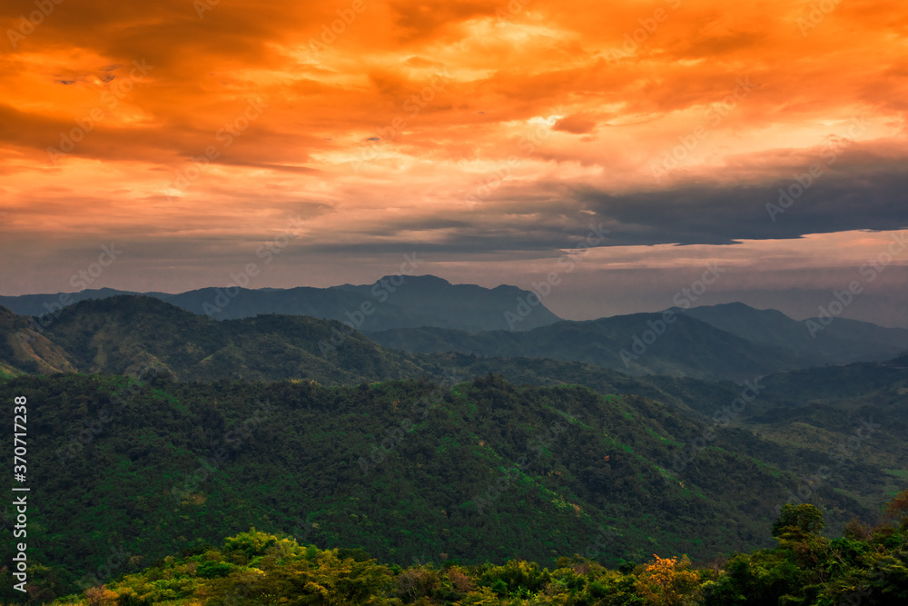 Naklejka premium Natural background, high angle from the high mountains that can see the scenery around, the wind blows through the cool, blurred of traveling, the integrity of the moist forest.