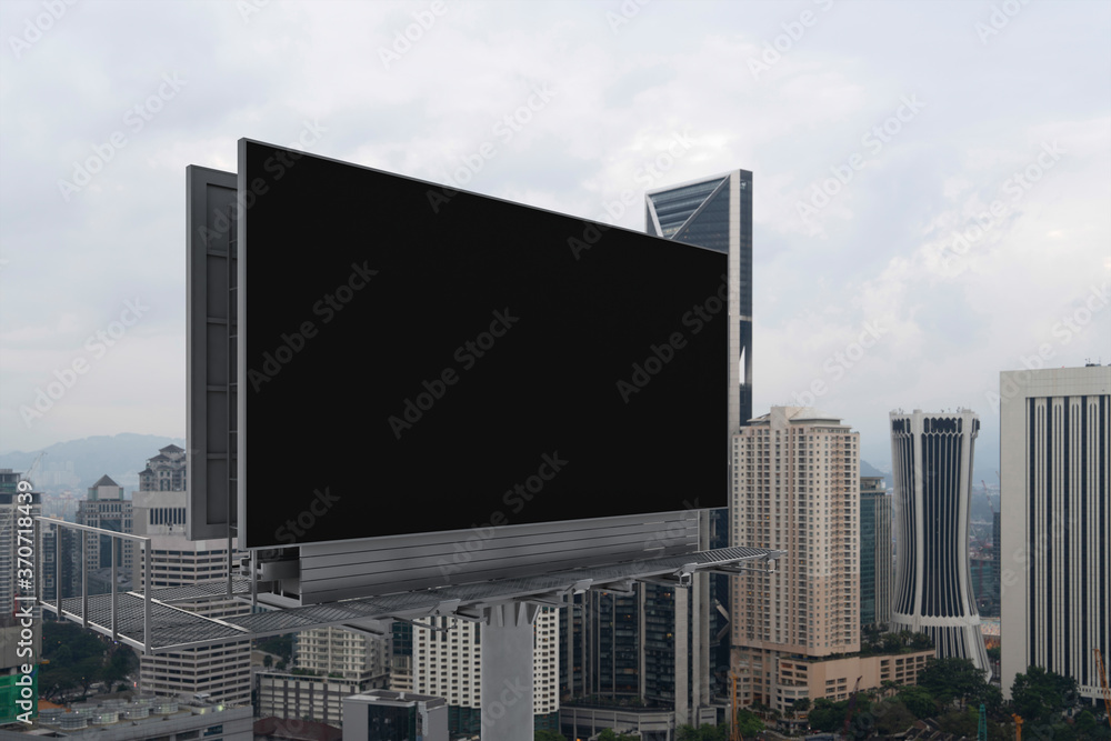 Blank black road billboard with Kuala Lumpur cityscape background at day time. Street advertising poster, mock up, 3D rendering. Side view. The concept of marketing communication. Blank black road billboard with Kuala Lumpur cityscape background at day time. Street advertising poster, mock up, 3D rendering. Side view. The concept of marketing communication.
