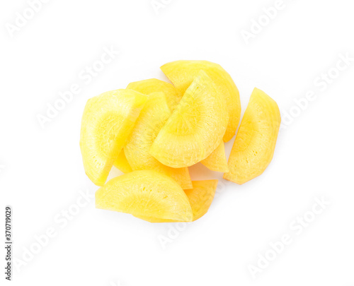 Slices of raw yellow carrot isolated on white, top view