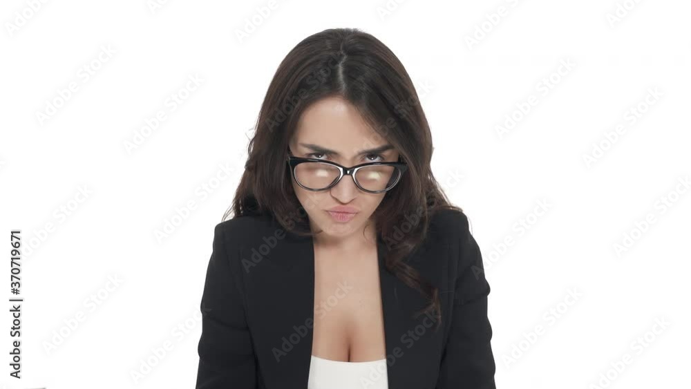 Top view of Caucasian woman in glasses with offended expression, sticking her tongue out. Isolated on white background Top view of Caucasian woman in glasses with offended expression, sticking her tongue out. Isolated on white background