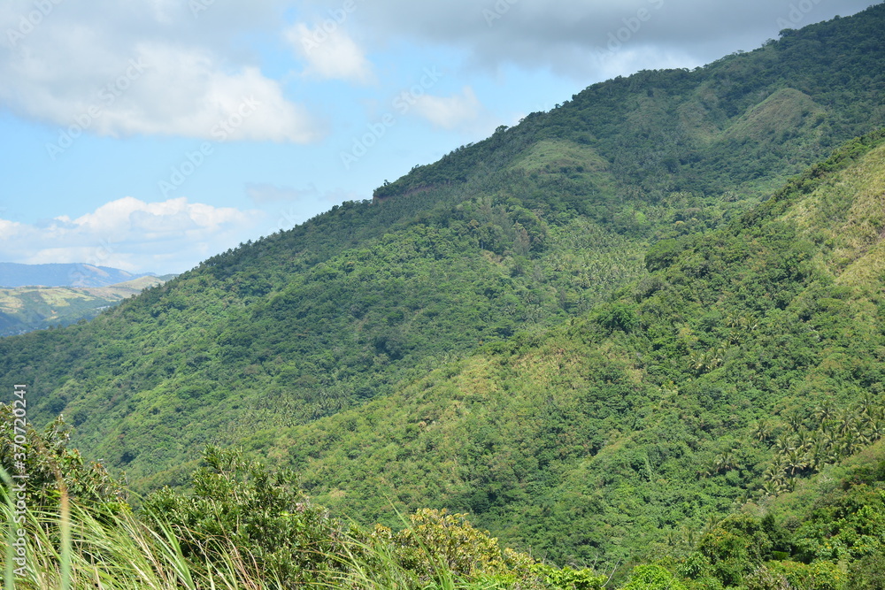 Naklejka premium Rock formation at mountain view white beach resort