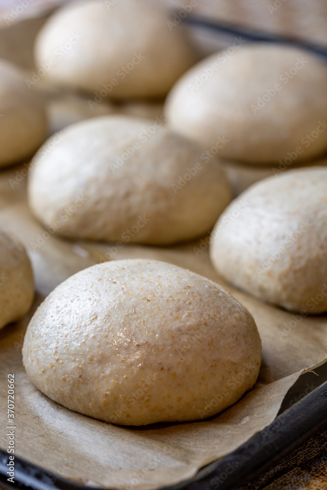 Whole grain burger buns. Proofing the dough before baking. Preparation Whole grain burger buns. Proofing the dough before baking. Preparation
