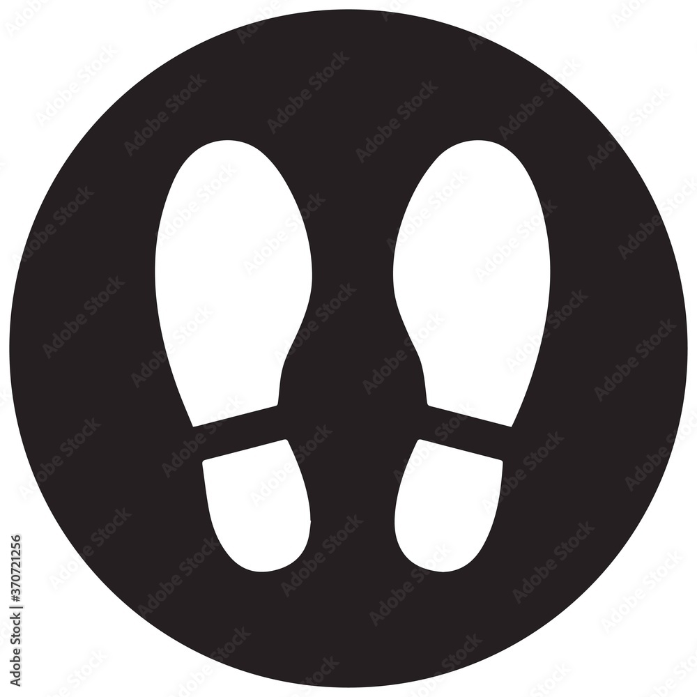Social distancing concept for preventing coronavirus covid-19 with white foot print stand here on black circle background Social distancing concept for preventing coronavirus covid-19 with white foot print stand here on black circle background