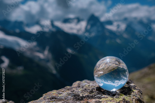 beautiful spherical glass ball with majestic Caucasian mountains