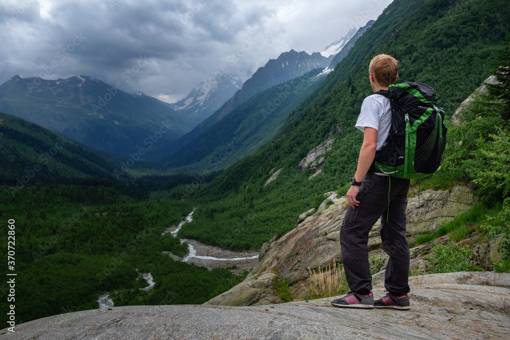 Man hiking at mountains with heavy backpack. Man hiking at mountains with heavy backpack.