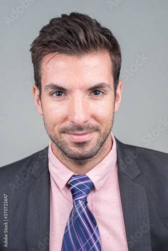 Portrait of young handsome Hispanic businessman in suit © Ranta Images